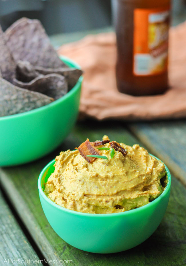 This gluten-free spicy pumpkin bacon dip is the perfect party snack to bring to your next fall party, tailgate, or couch snack. This spicy dip combines the healthy creaminess of greek yogurt cream cheese and pumpkin, with the heartiness of the cheese and bacon, and the spice of garlic, green onion, and cayenne pepper. Put this lightened up dip out with your favorite dippers and it will be gone in seconds. www.ahotsouthernmess.com