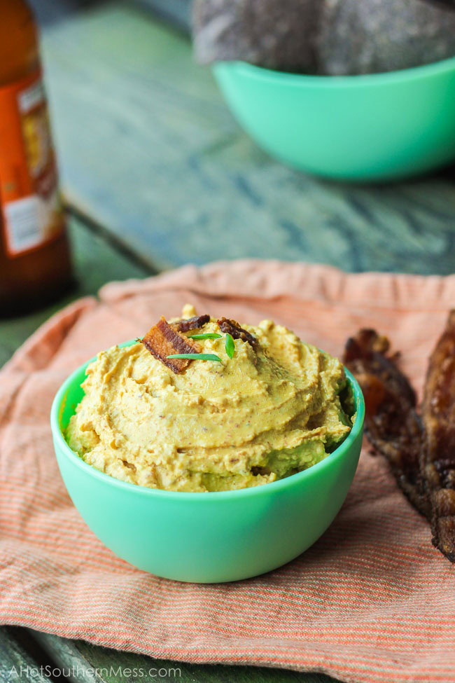 This gluten-free spicy pumpkin bacon dip is the perfect party snack to bring to your next fall party, tailgate, or couch snack. This spicy dip combines the healthy creaminess of greek yogurt cream cheese and pumpkin, with the heartiness of the cheese and bacon, and the spice of garlic, green onion, and cayenne pepper. Put this lightened up dip out with your favorite dippers and it will be gone in seconds. www.ahotsouthernmess.com