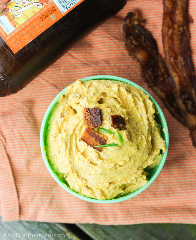 This gluten-free spicy pumpkin bacon dip is the perfect party snack to bring to your next fall party, tailgate, or couch snack. This spicy dip combines the healthy creaminess of greek yogurt cream cheese and pumpkin, with the heartiness of the cheese and bacon, and the spice of garlic, green onion, and cayenne pepper. Put this lightened up dip out with your favorite dippers and it will be gone in seconds. www.ahotsouthernmess.com