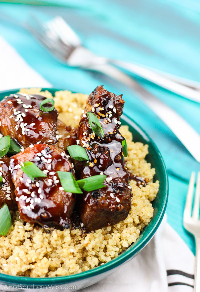 Spicy sticky asian ribs are drizzled in sweet and spicy glaze, kissed to a slight crunch on the grill, and melt-in-your-mouth, incredibly tender on the inside. These pork ribs are finger-lickin' and slap yo mama silly kind of 'good'. www.ahotsouthernmess.com