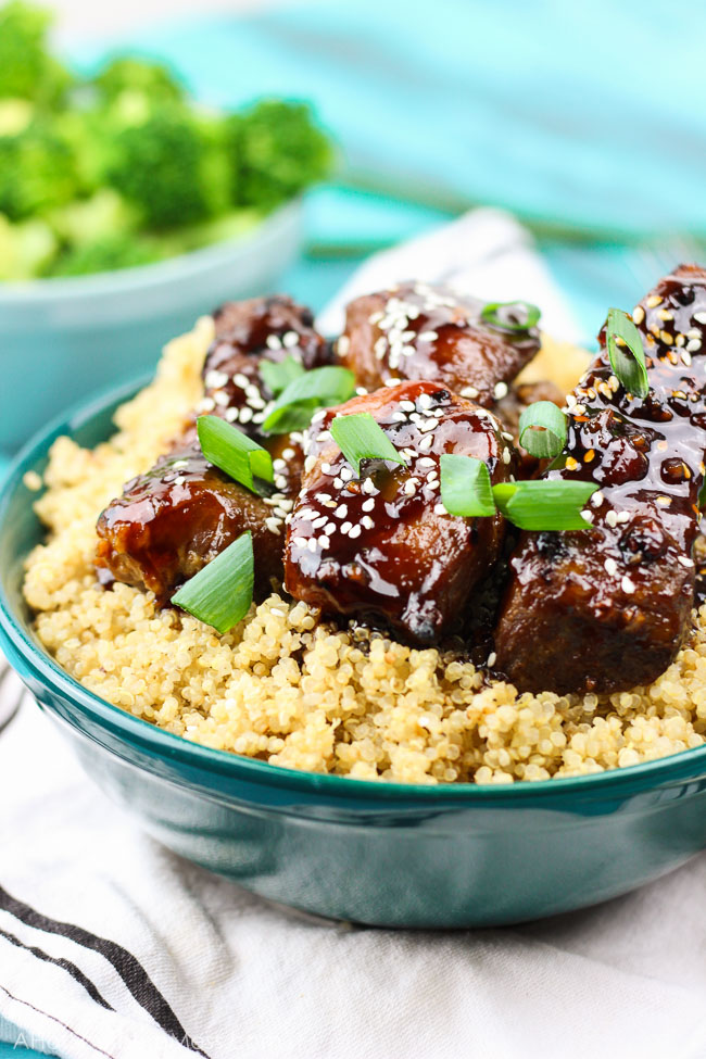 Spicy sticky asian ribs are drizzled in sweet and spicy glaze, kissed to a slight crunch on the grill, and melt-in-your-mouth, incredibly tender on the inside. These pork ribs are finger-lickin' and slap yo mama silly kind of 'good'. www.ahotsouthernmess.com