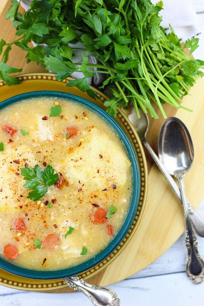 This spicy gluten-free slow cooker chicken and dumplings recipe is so easy to put together, you need just 5 minutes, and let simmer all day. The spicy taste {easily adjusted to your spice level!} pairs well with the sweet doughy gluten-free dumplings and tender bites of chicken and vegetables. Perfect for a busy fall weeknight that the whole family will love, just serve and enjoy! www.ahotsouthernmess.com