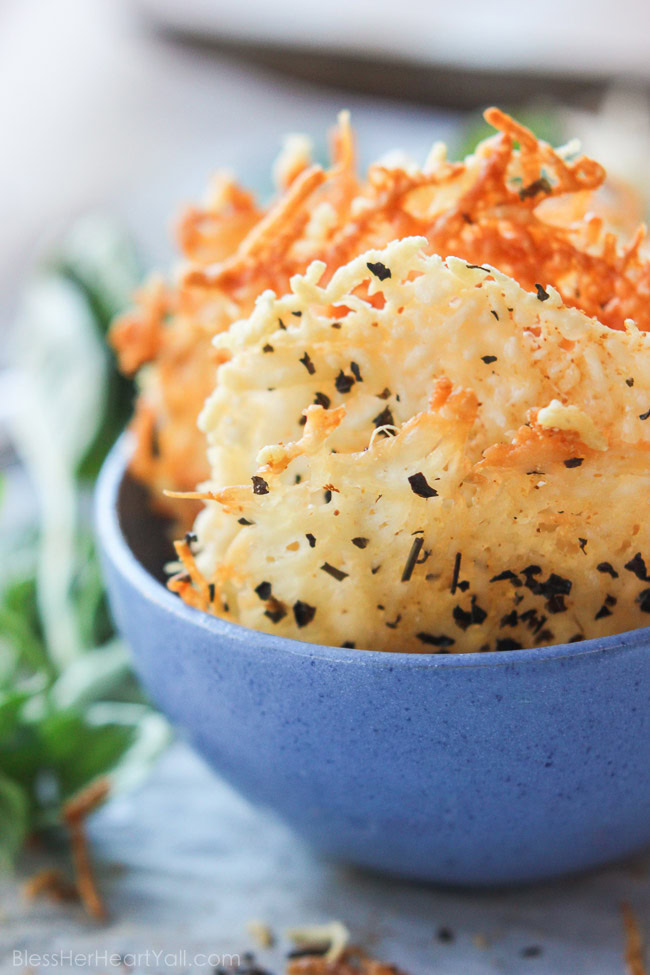 Garlic basil parmesan crisps are an easy 3 ingredient baked recipe! These great dippers are perfect appetizers or snacks for any gluten-free or low carb eaters and are huge hits at parties! All you need is parmesan, basil, garlic powder and 5 minutes beside your oven! www.blessherheartyall.com