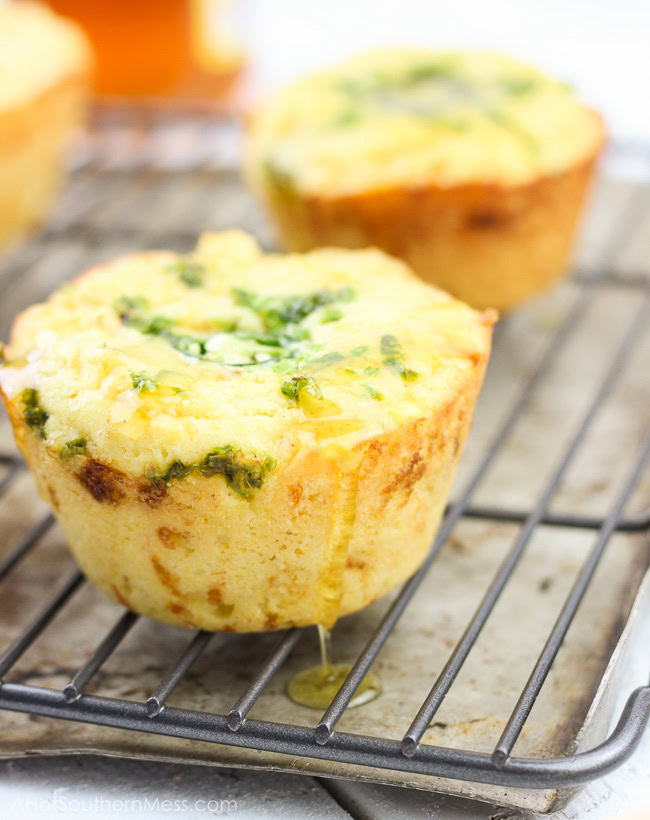 These gluten-free jalapeno cheddar cornbread cupcakes are very quick and easy to put together. The jalapeno adds some spice, the cheddar some heartiness, and the honey drizzle some sweet to finish it off. A delicious side dish to any meal that needs to warm you up and keep your belly happy. www.ahotsouthernmess.com