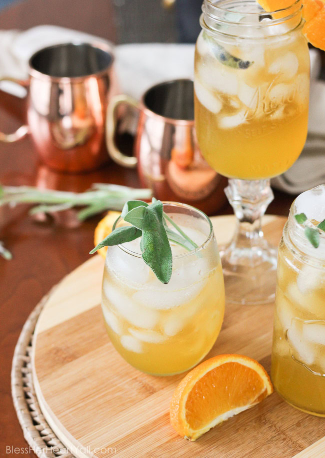 This honey bear cocktail is the perfect cocktail to sip on during those chilly fall evenings with friends on your porch or for entertaining those guests as they walk in the front door of your Thanksgiving day festivities. Made with a simple syrup of honey, sage, and orange, then combined with southern bourbon over ice, you will be sipping on a fresh, mellow, slightly sweet cocktail that everyone {including those honey bears!} will find perfect all fall long. www.blessherheartyall.com