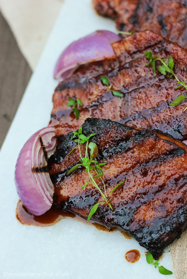 These gluten-free southern cayenne glazed pork chops are an easy 5-ingredient recipe that combines the sweetness of brown sugar with the spiciness of cayenne pepper. A few minutes marinating and then quickly kissed on the grill, these southern glazed pork chops create a tender, juicy, flavorful meal in just minutes! www.blessherheartyall.com