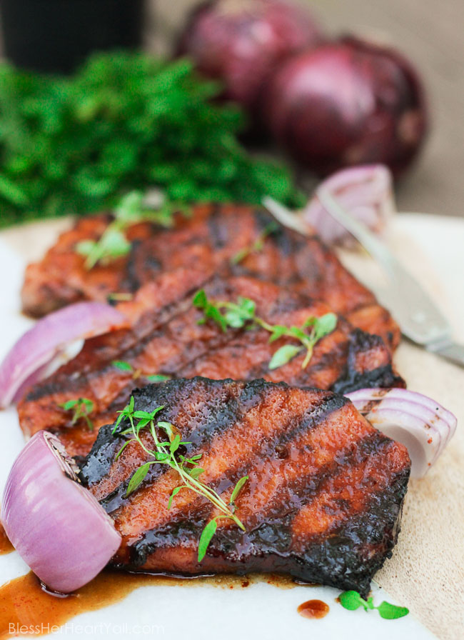 These gluten-free southern cayenne glazed pork chops are an easy 5-ingredient recipe that combines the sweetness of brown sugar with the spiciness of cayenne pepper. A few minutes marinating and then quickly kissed on the grill, these southern glazed pork chops create a tender, juicy, flavorful meal in just minutes! www.blessherheartyall.com