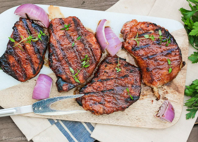 These gluten-free southern cayenne glazed pork chops are an easy 5-ingredient recipe that combines the sweetness of brown sugar with the spiciness of cayenne pepper. A few minutes marinating and then quickly kissed on the grill, these southern glazed pork chops create a tender, juicy, flavorful meal in just minutes! www.blessherheartyall.com