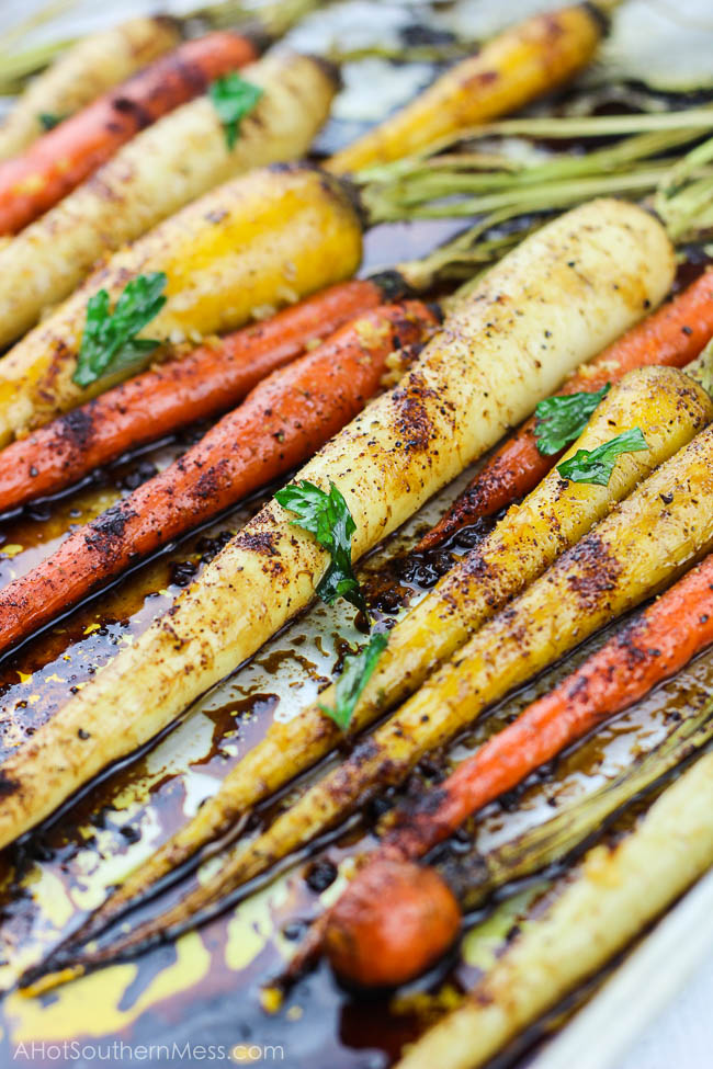 With 5 minutes of prep work and a couple of simple ingredients, these spicy honey garlic roasted carrots are an easy gluten-free fall side dish that is both full of flavor and healthy. With the combination of chili powder, garlic, and honey, with an easy balsamic glaze drizzle, you have both a sweet and spicy, tender yet crunchy vegetable for your table spread. www.ahotsouthernmess.com