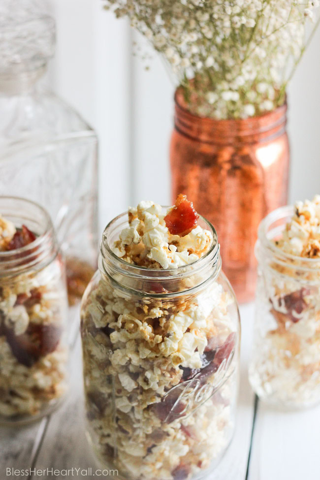 This maple, bacon, bourbon popcorn hits all the right spots, with it's freshly popped popcorn, sprinkled with thick-cut applewood bacon, and then drizzled with butter, salt, maple syrup, and of course bourbon! It's a quick, easy, and inexpensive DIY gift for friends, co-workers, and host/hostess's this holiday season! www.blessherheartyall.com DIY Hostess Gift: Maple, Bacon, Bourbon Popcorn