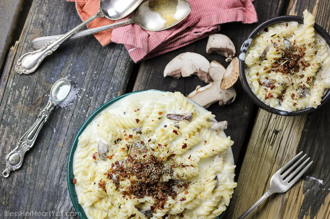 This spicy gluten-free mac and cheese recipe will blow your socks off in under 30 minutes! Let's combine bacon, mushrooms, truffle oil, some heat, and mac and cheese, shall we? Then we will create spicy, creamy, cheesy perfection. www.blessherheartyall.com