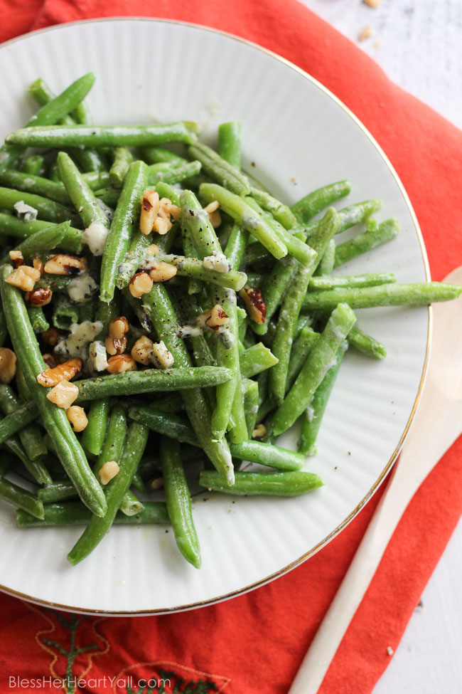 easy bleu cheese green beans Fresh green beans are prepared {can be prepared in TWO ways!} with a decadent blue cheese sauce drizzled and stirred over top for a warm, hearty, cheesy, creamy addition to your holiday table. And the best part? It will look like you had been in the kitchen sweating to make this dish happen, when in reality… it was soooooo easy-peasy. | www.blessherheartyall.com|