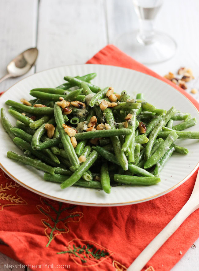 easy bleu cheese green beans Fresh green beans are prepared {can be prepared in TWO ways!} with a decadent blue cheese sauce drizzled and stirred over top for a warm, hearty, cheesy, creamy addition to your holiday table. And the best part? It will look like you had been in the kitchen sweating to make this dish happen, when in reality… it was soooooo easy-peasy. | www.blessherheartyall.com|