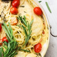 This one-pot rosemary goat cheese chicken pasta skillet is a cheesy, creamy, 30-minute meal with bold flavors! This pasta skillet incorporates garlic, cream, goat cheese, and rosemary as a base for the creamy sauce. Then gluten-free noodles, chicken breasts, and fresh tomatoes and spinach leaves are mixed together and smothered in this hearty and flavorful sauce! www.blessherheartyall.com