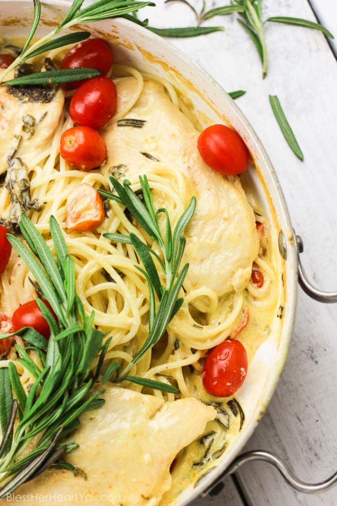 This one-pot rosemary goat cheese chicken pasta skillet is a cheesy, creamy, 30-minute meal with bold flavors! This pasta skillet incorporates garlic, cream, goat cheese, and rosemary as a base for the creamy sauce. Then gluten-free noodles, chicken breasts, and fresh tomatoes and spinach leaves are mixed together and smothered in this hearty and flavorful sauce! www.blessherheartyall.com