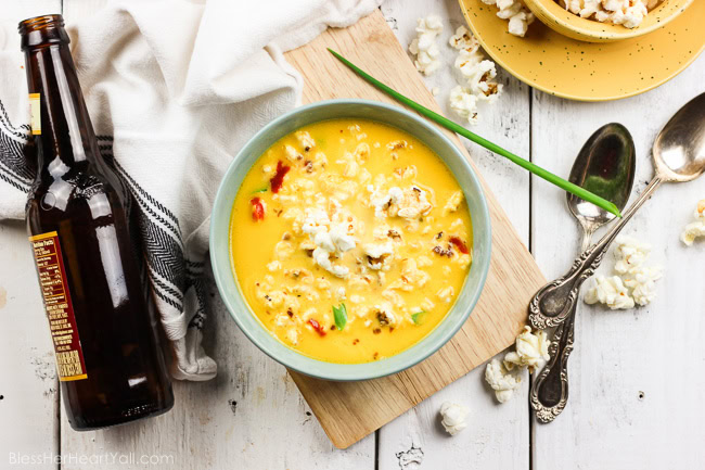 An easy gluten-free slow cooker recipe for beer cheese soup! Toss your ingredients in the crock pot and let it cook! www.blessherheartyall.com