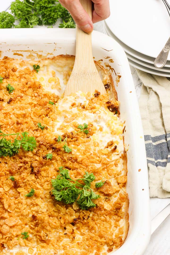 This is the best gluten-free corn souffle in the entire world {and is so easy to put together and throw in the oven!}! Creamy cheesy gluten-free ingredients are mixed and melted together, baked to sweet perfection with sweet crunchy toppings on top! www.blessherheartyall.com