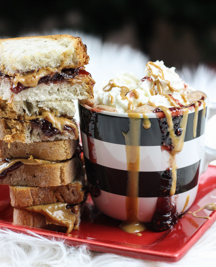 This peanut butter and jelly hot chocolate is a decadent and rich twist on the classic hot chocolate. Melting smooth chocolate with creamy peanut butter and sweetened with your favorite berry flavor, (and of course topped with whipped cream and other goodies!) make this an instant cold-weathered favorite. www.blessherheartyall.com