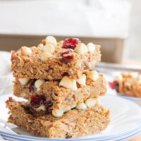 These gluten-free quinoa breakfast bars are a sweet and easy breakfast option for those on-the-go mornings. These breakfast / protein bars combine quinoa, coconut flour, honey, and peanut butter with dried fruits and white chocolate chips to make a delicious baked gluten-free breakfast! www.BlessHerHeartYall.com