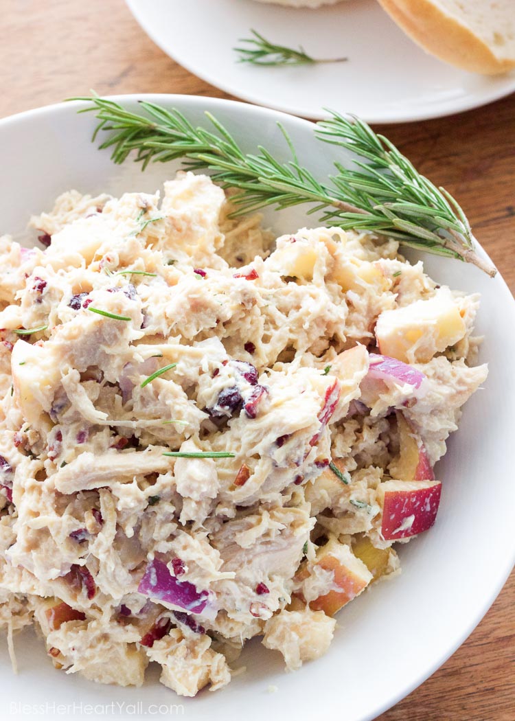 OMG yum! This rosemary greek yogurt chicken salad is a light and fresh (and gluten-free!) approach to chicken salad! The list of healthy ingredients come together to make one sweet and savory masterpiece of a salad or gluten free sandwich!