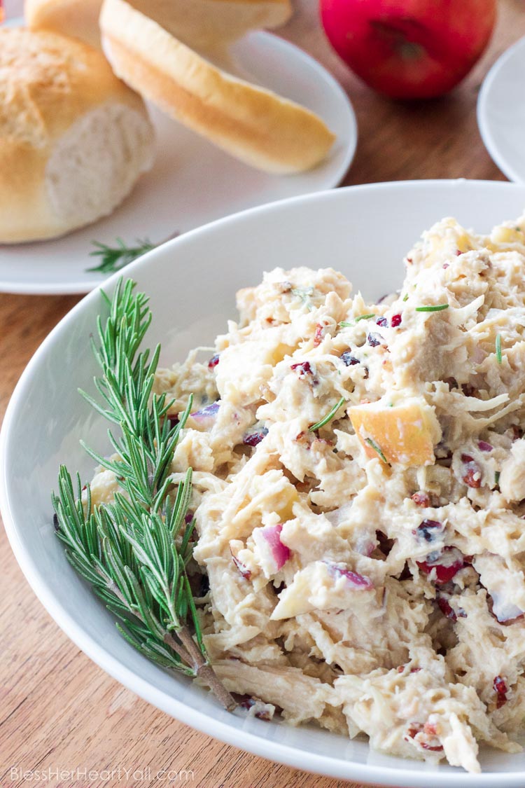 OMG yum! This rosemary greek yogurt chicken salad is a light and fresh (and gluten-free!) approach to chicken salad! The list of healthy ingredients come together to make one sweet and savory masterpiece of a salad or gluten free sandwich!