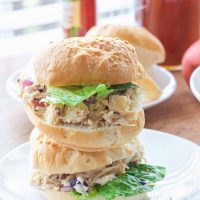 OMG yum! This rosemary greek yogurt chicken salad is a light and fresh (and gluten-free!) approach to chicken salad! The list of healthy ingredients come together to make one sweet and savory masterpiece of a salad or gluten free sandwich!