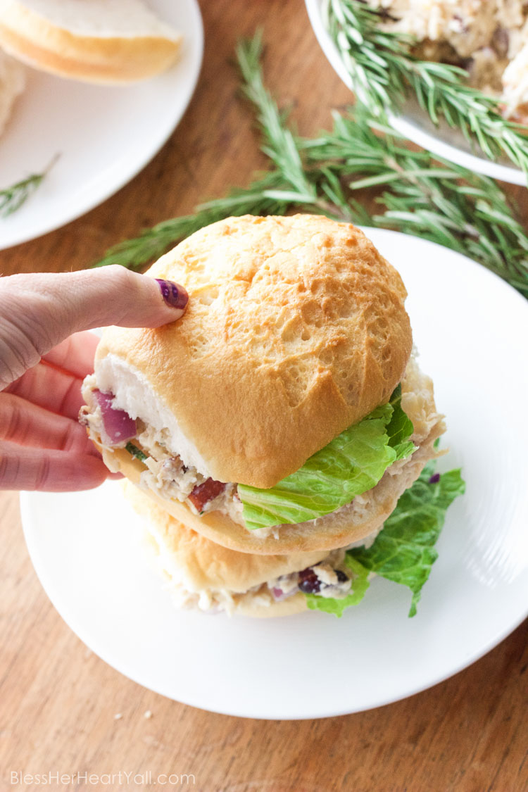 OMG yum! This rosemary greek yogurt chicken salad is a light and fresh (and gluten-free!) approach to chicken salad! The list of healthy ingredients come together to make one sweet and savory masterpiece of a salad or gluten free sandwich!