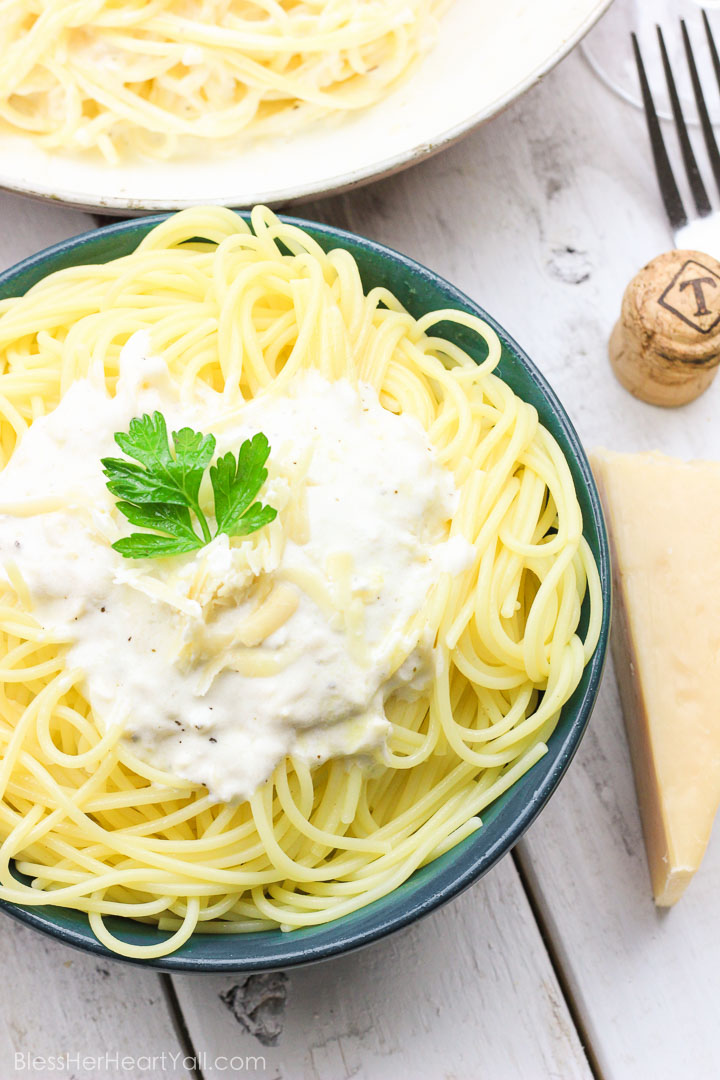 This Skinny Champagne Alfredo recipe is amazing and quick to make! Instead of those heavy unhealthy creams, healthy greek yogurt is used! And if we needed a reason to use up extra New Year's Eve champagne, here it is! It is used in lieu of chicken broth or white wine in the typical alfredo sauce! Cream, healthy, fun deliciousness! www.blessherheartyall.com