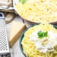 This Skinny Champagne Alfredo recipe is amazing and quick to make! Instead of those heavy unhealthy creams, healthy greek yogurt is used! And if we needed a reason to use up extra New Year's Eve champagne, here it is! It is used in lieu of chicken broth or white wine in the typical alfredo sauce! Cream, healthy, fun deliciousness! www.blessherheartyall.com