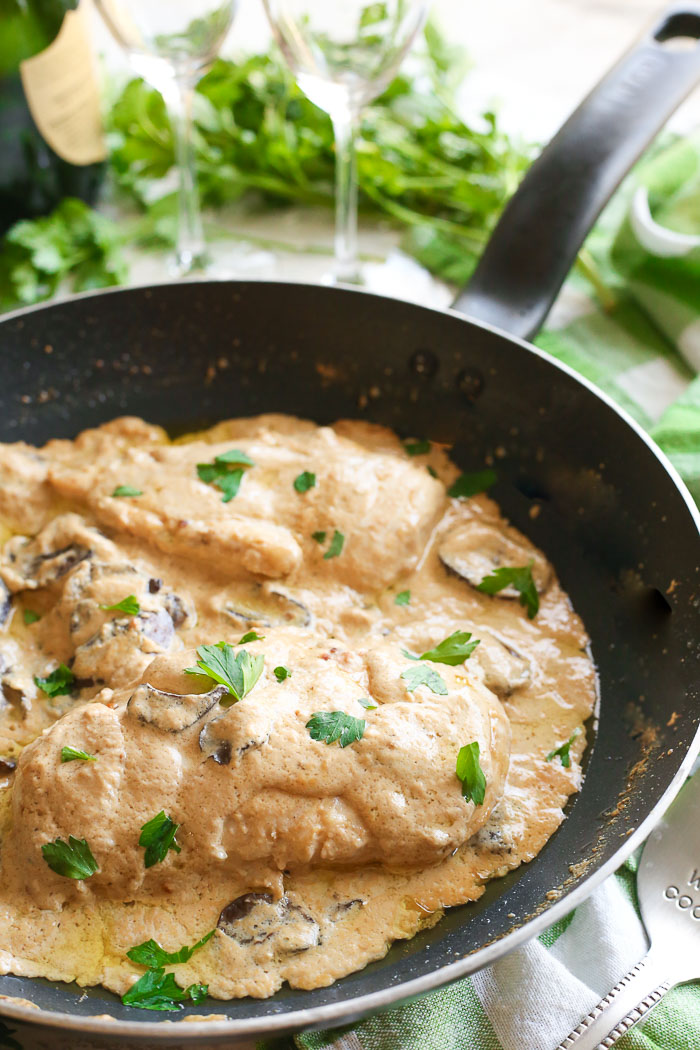 champagne chicken with mushrooms cooked in skillet