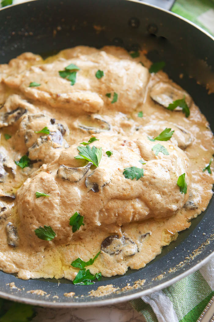 champagne chicken with mushrooms cooked in skillet