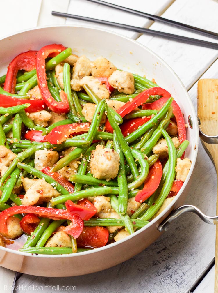 This 30 minute coconut sesame chicken and green beans skillet is a tasty and fresh dish that combines coconut oil, fresh honey, chili flakes, and garlic and then drizzled over fresh chicken and green beans and baked to tender perfection!