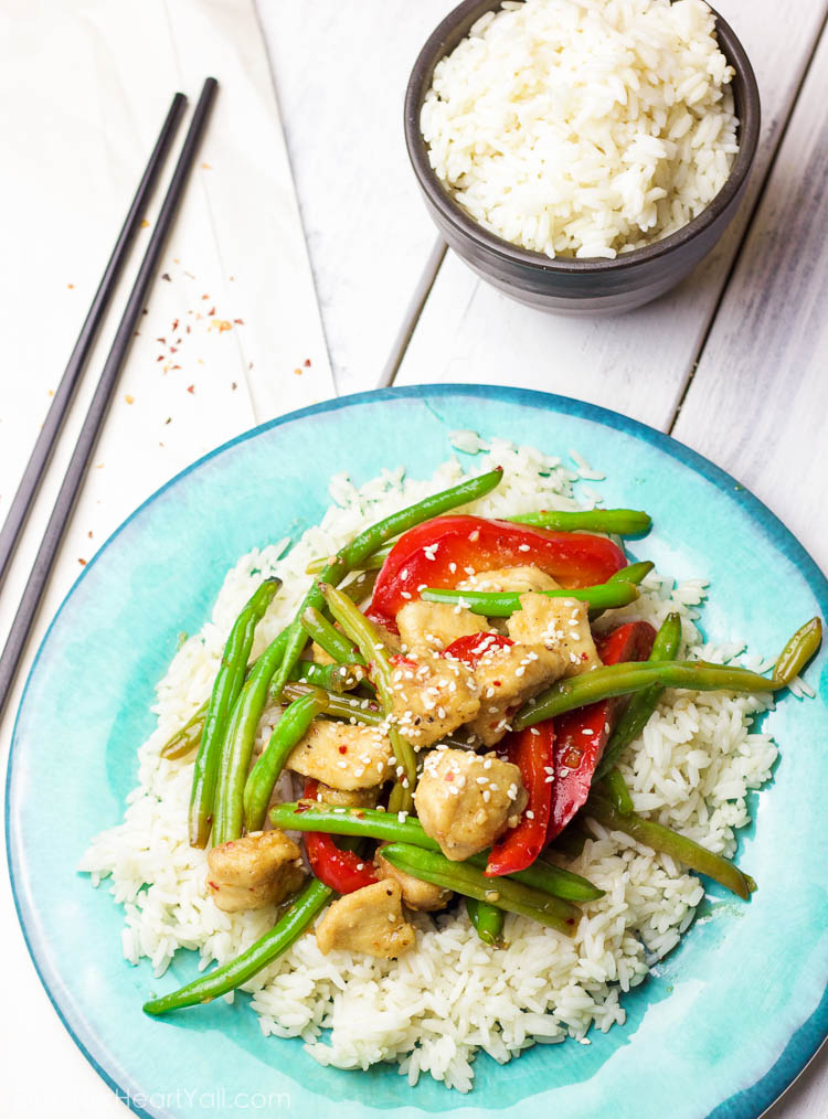 This 30 minute coconut sesame chicken and green beans skillet is a tasty and fresh dish that combines coconut oil, fresh honey, chili flakes, and garlic and then drizzled over fresh chicken and green beans and baked to tender perfection!