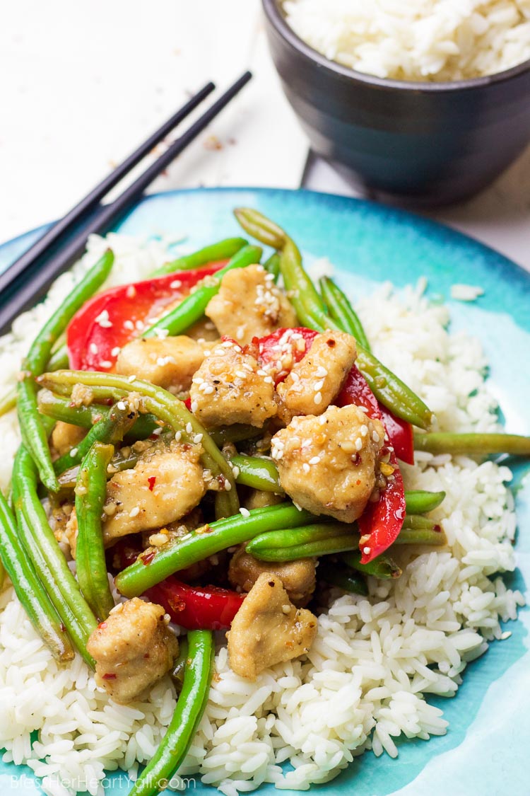 This 30 minute coconut sesame chicken and green beans skillet is a tasty and fresh dish that combines coconut oil, fresh honey, chili flakes, and garlic and then drizzled over fresh chicken and green beans and baked to tender perfection!