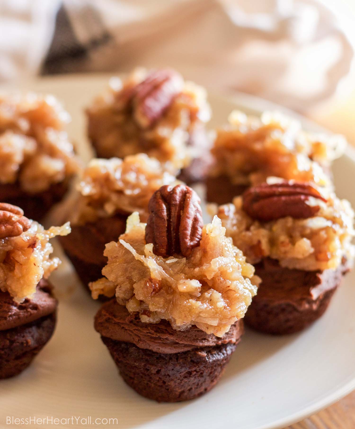 These fluffy and soft made-from-scratch gluten-free german chocolate mini cupcakes are a decadent little sweet treat, perfect for when you need a bite of something full of coconut, chocolate, and creaminess!