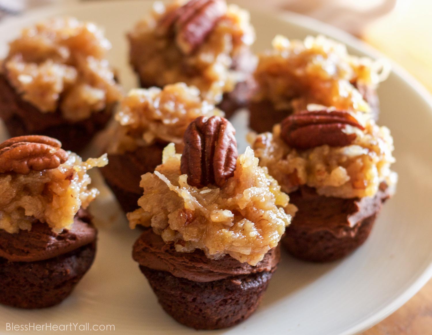 These fluffy and soft made-from-scratch gluten-free german chocolate mini cupcakes are a decadent little sweet treat, perfect for when you need a bite of something full of coconut, chocolate, and creaminess!