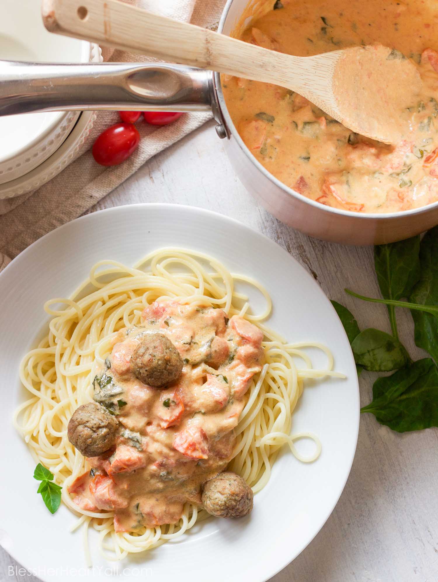 This easy goat cheese spaghetti and meatballs recipe combines fresh goat cheese, smashed tomatoes, and fresh basil, garlic, and onion for a delicious meal in less than 20 minutes!