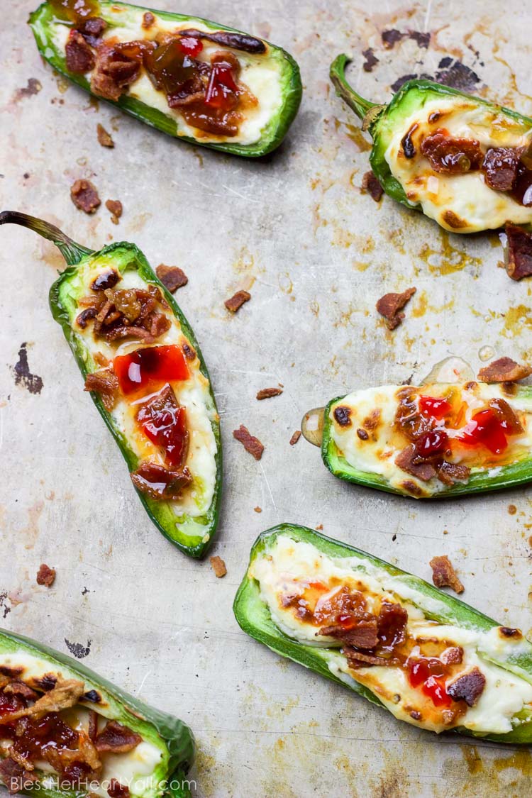 These bacon goat cheese jalapeno poppers are a fast and delicious little appetizer full of creamy goat cheese, crisp bacon crumbles, and sweet pepper jelly overtop quickly charred jalapenos for the perfect sweet and spicy party treat!