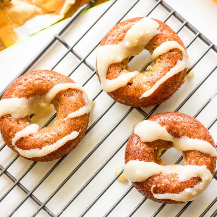 These gluten-free banana bread donuts are a great reason to wake up in the morning! Soft and moist banana bread is baked into fluffy donuts and then drizzled with an easy and quick honey cream cheese drizzle.