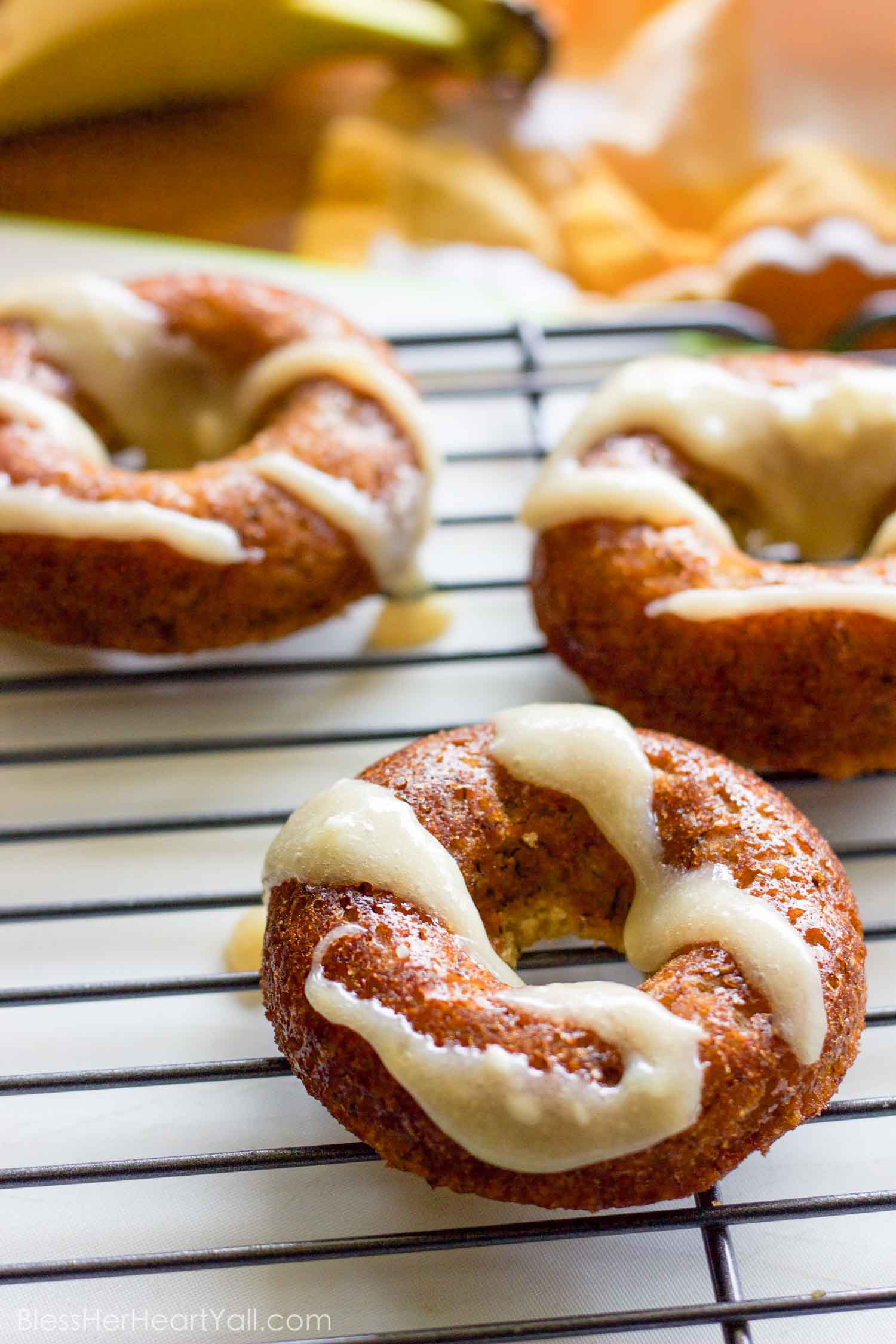 These gluten-free banana bread donuts are a great reason to wake up in the morning! Soft and moist banana bread is baked into fluffy donuts and then drizzled with an easy and quick honey cream cheese drizzle.