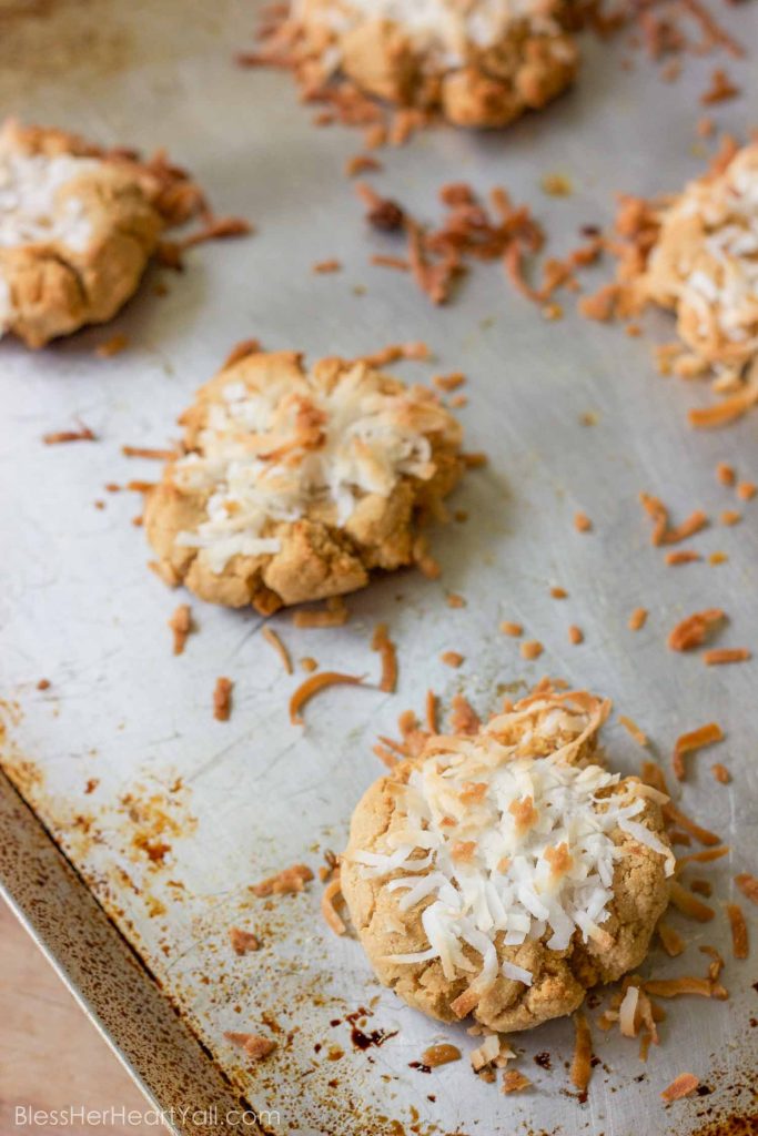 These quick gluten-free smashed coconut peanut butter cookies combine coconut flour, peanut butter, and fresh coconut flakes together for fluffy and sweet cookies in just minutes!