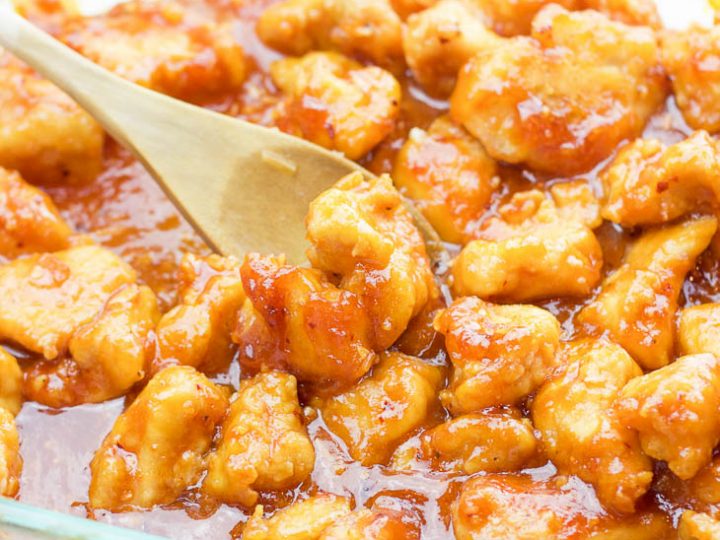 This one-pan baked gluten-free sweet and sour chicken recipe is 100% gluten-free and not fried in a frying pan for even a second. Tender pieces of chicken are lightly breaded in a homemade spiced coating and then drizzled in coconut oil and a sweet and tangy sticky sauce and then baked to perfection.