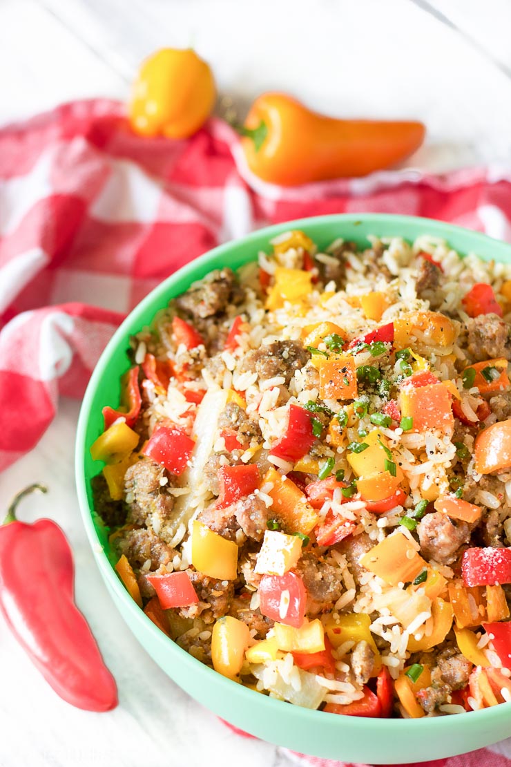 This gluten-free chopped stuffed pepper salad combines spicy sausage with fresh diced bell peppers and sweet onion, fluffy rice, and is seasoned with a combination of sizzling creole spices for one salad that is burst with flavor spoonful after spoonful!