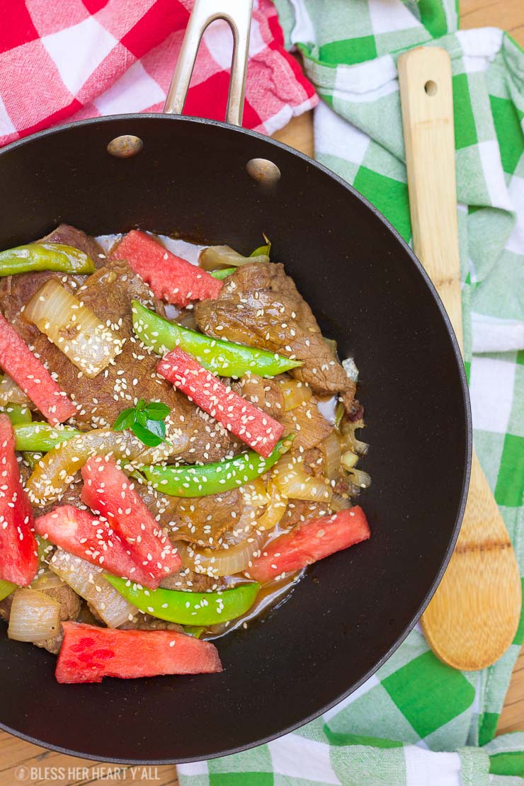 This simple watermelon stir-fry recipe combines the sweet refreshing flavors of juicy ripe watermelon with the savoury flavors of the asian-inspired stir-fry! The perfect-for-summer sauce has just a touch of sweet and light with it's combination of fresh lime juice and garlic. This summer dish definitely won't weigh you down in the sizzling heat!