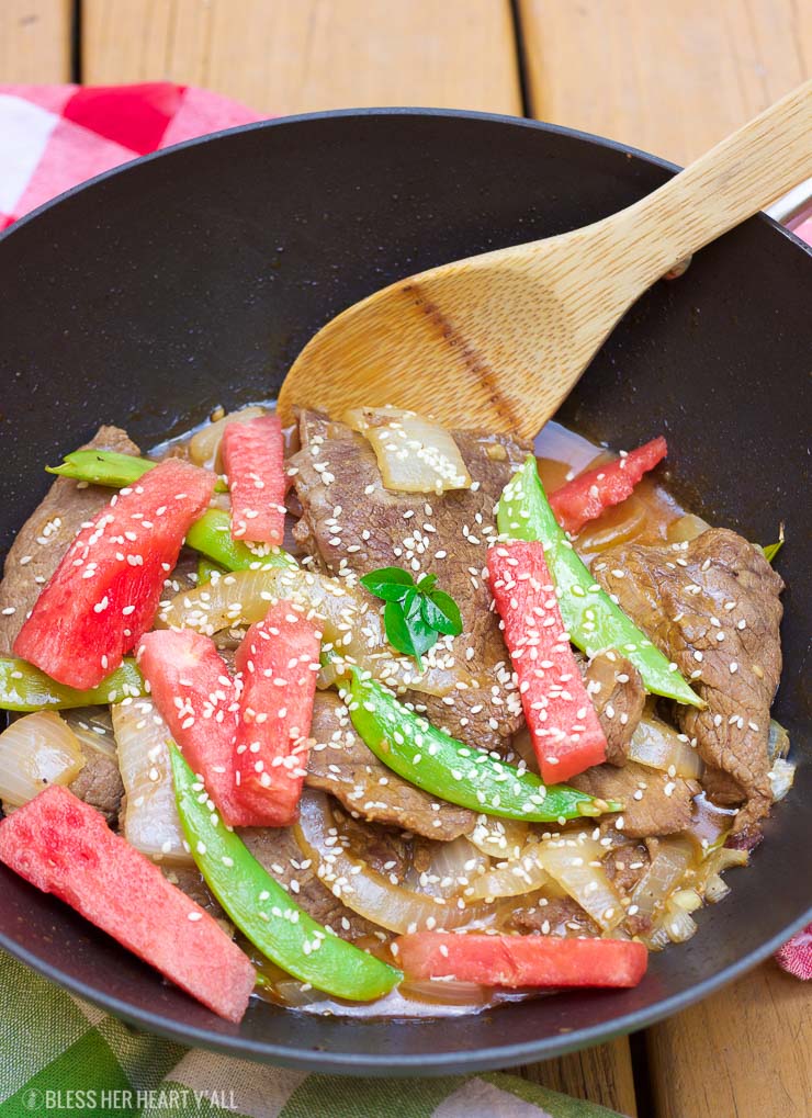 This simple watermelon stir-fry recipe combines the sweet refreshing flavors of juicy ripe watermelon with the savoury flavors of the asian-inspired stir-fry! The perfect-for-summer sauce has just a touch of sweet and light with it's combination of fresh lime juice and garlic. This summer dish definitely won't weigh you down in the sizzling heat!