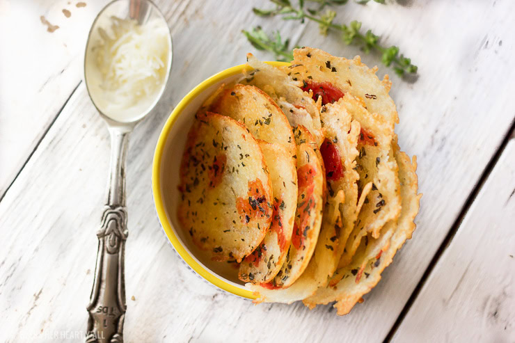 These pepperoni pizza mozzarella crisps are the perfect little dippable appetizer or snack. Shredded mozzarella cheese is quickly baked with pepperoni pieces, garlic, and basil into crispy addictive bites that are easily dunkable into your favorite marinara sauce!