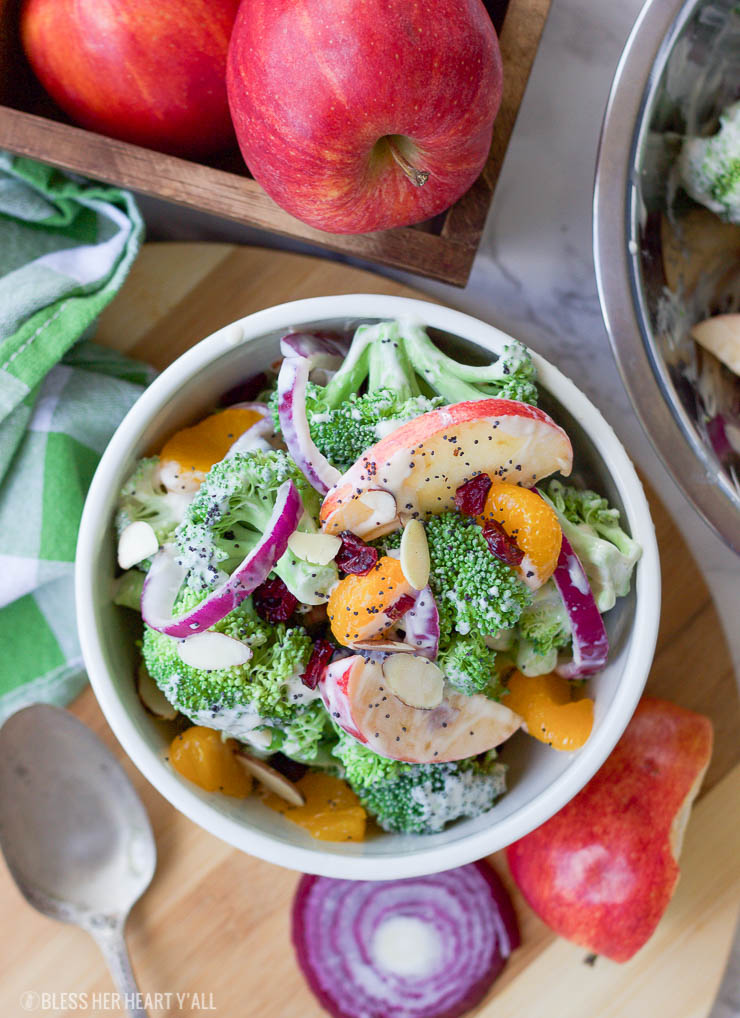 This healthy fall broccoli salad is gluten-free, grain-free, vegetarian, and is with bursting with autumn flavor! Greek yogurt, honey, lime juice, fresh and dried fruits, and almonds are tossed together to create a light, sweet, and creamy drizzle that's perfect for any fall table setting!