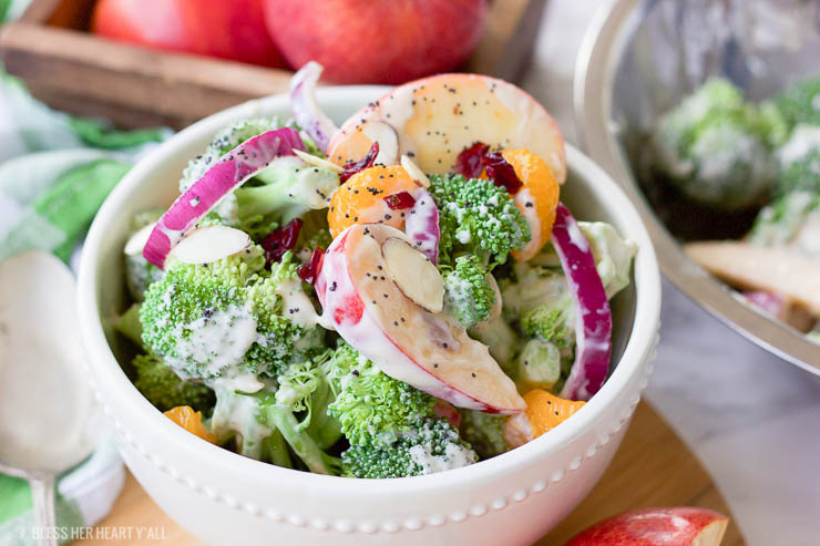 This healthy fall broccoli salad is gluten-free, grain-free, vegetarian, and is with bursting with autumn flavor! Greek yogurt, honey, lime juice, fresh and dried fruits, and almonds are tossed together to create a light, sweet, and creamy drizzle that's perfect for any fall table setting!