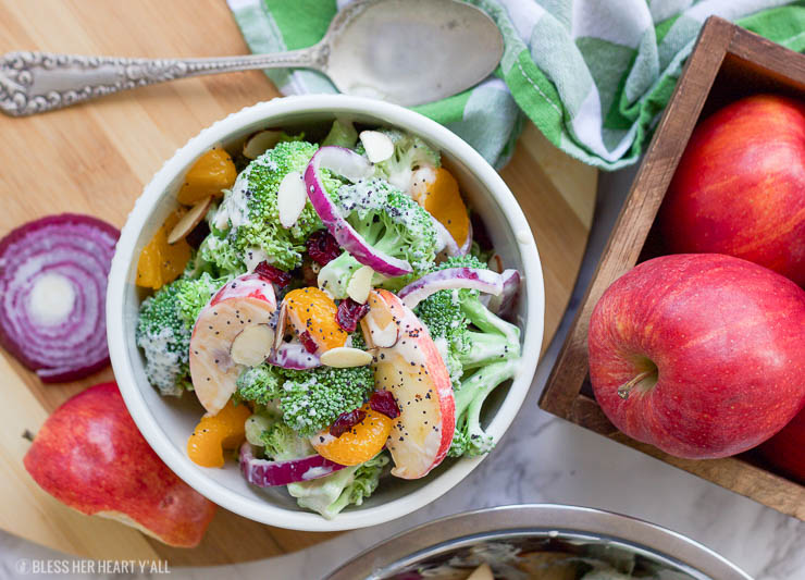 This healthy fall broccoli salad is gluten-free, grain-free, vegetarian, and is with bursting with autumn flavor! Greek yogurt, honey, lime juice, fresh and dried fruits, and almonds are tossed together to create a light, sweet, and creamy drizzle that's perfect for any fall table setting!