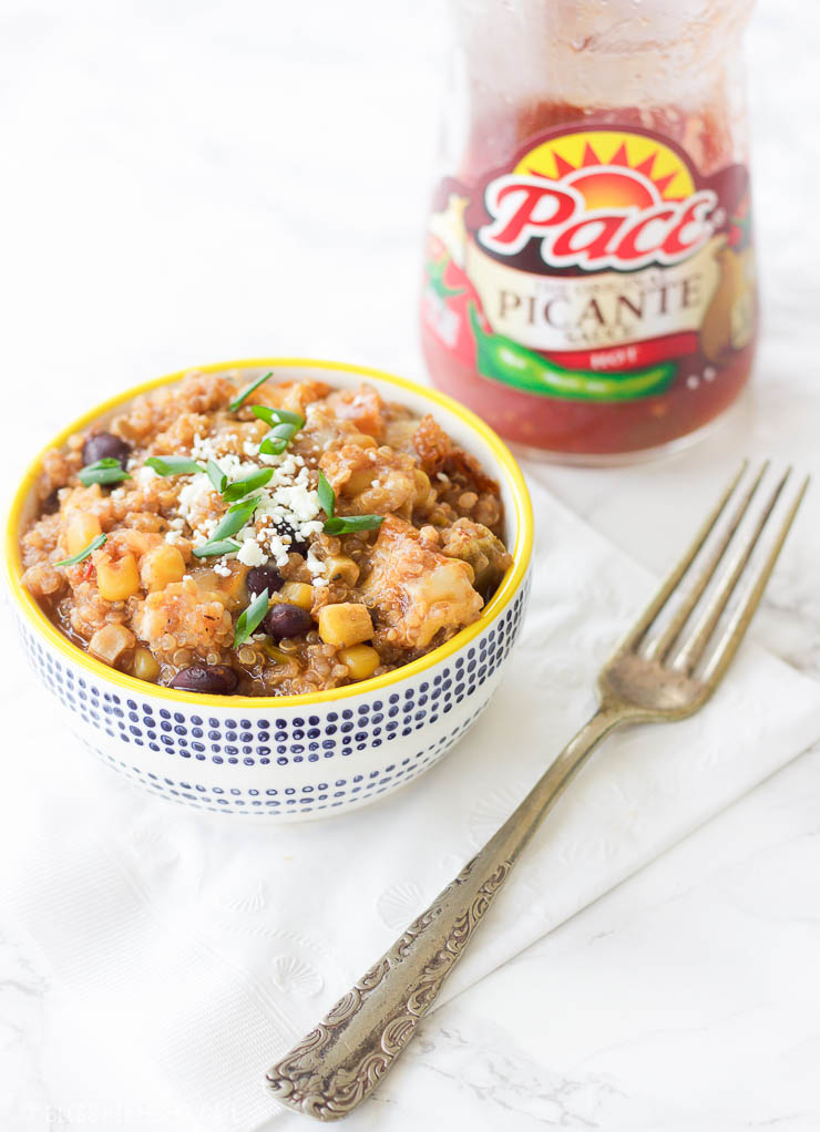 This slow cooker mexican quinoa dip is the perfect gluten-free, vegetarian, and paleo friendly tailgating comfort food! It's warm and gooey, filling and nutritious, and cooks itself in the slow cooker for a quick 2-3 hours. Use this recipe as a dip with your favorite sweet potato chips, rolled up in a tortilla for a quick enchilada, or toss it over a salad to add a burst of flavor!